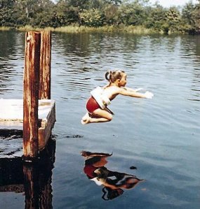 Jane jumping into the river.
